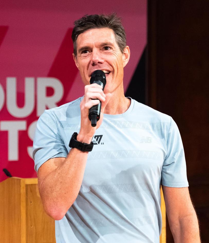Martin Yelling on stage speaking with a microphone in hand